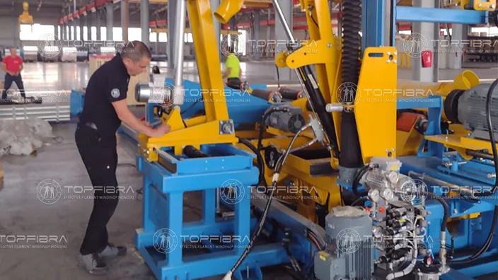 Technician performing final inspection on custom-built GRP machine before shipping at Topfibra facility